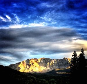 View of mountain range against cloudy sky