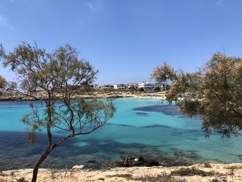 Scenic view of sea against clear blue sky