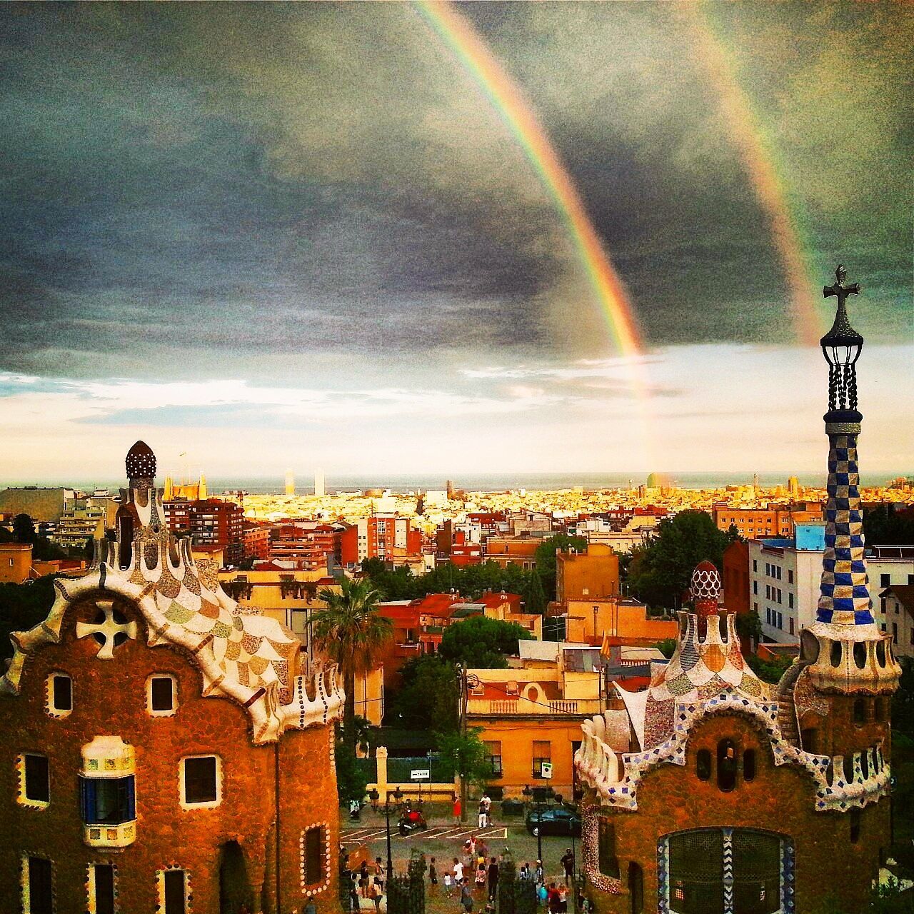 building exterior, architecture, built structure, sky, cloud - sky, cityscape, city, cloudy, residential district, residential building, high angle view, sunset, residential structure, crowded, rainbow, cloud, outdoors, community, weather, house