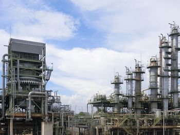 Low angle view of factory against sky