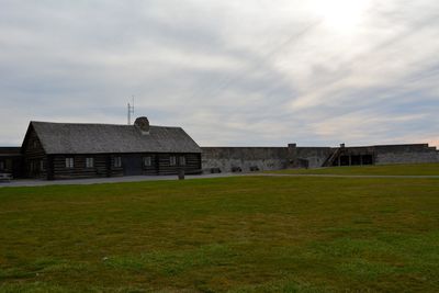 House on field against sky