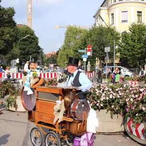 People on bicycle by road against sky