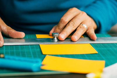 Cropped image of man working at table