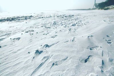 Footprints on snow covered land