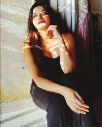 Portrait of woman standing at home