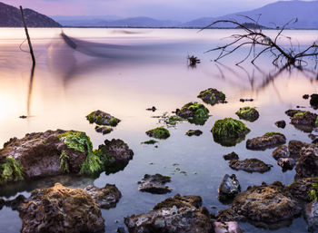 Scenic view of sea against sky at sunset