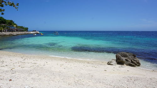 Scenic view of sea against clear sky