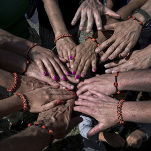 High angle view of people hands