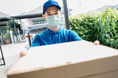 Portrait of man working on table