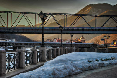 Scenic view of snow covered mountains against sky during sunset