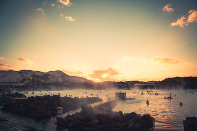 Scenic view of lake against sky during sunset