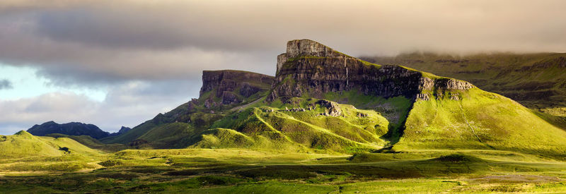 Panoramic view of rocks on land against sky