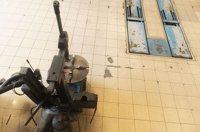 Low angle view of pipes on floor against wall