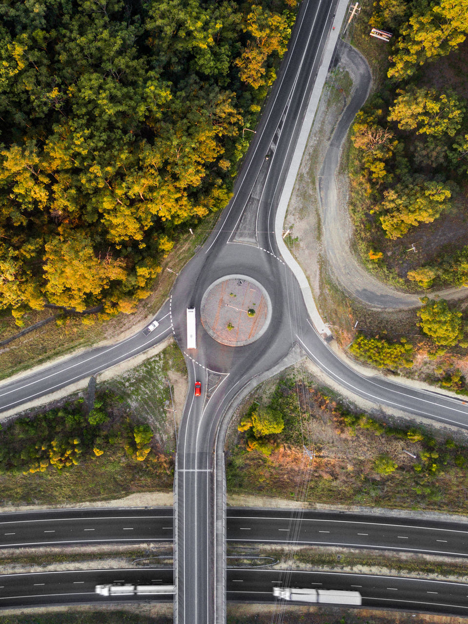 transportation, road, tree, plant, no people, nature, highway, day, motion, autumn, bridge, architecture, curve, connection, outdoors, bridge - man made structure, multiple lane highway, city, mode of transportation, motor vehicle, change