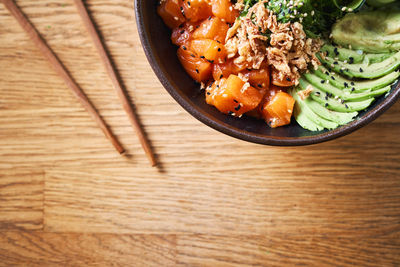 High angle view of chopped vegetables in bowl on table