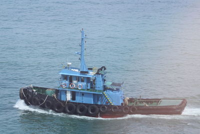 High angle view of boat sailing in sea