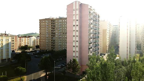 Buildings in city against clear sky