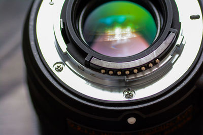 Close-up of camera lens on table