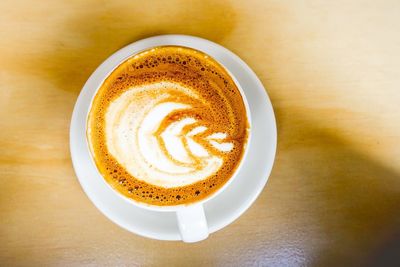 Close-up of cappuccino on table