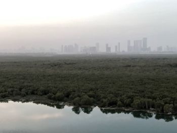 Scenic view of city and buildings against sky