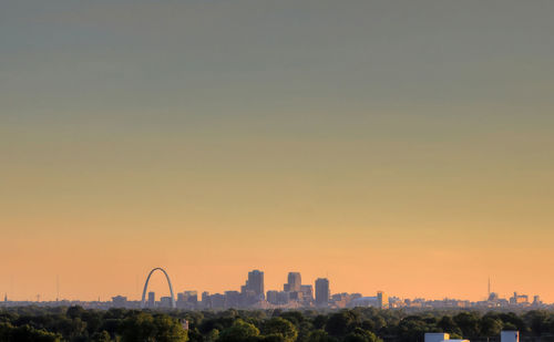 Cityscape against sky during sunset