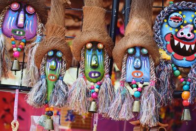 Close-up of colorful masks for sale