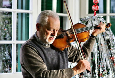 Portrait of man playing guitar