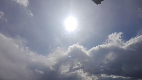 Low angle view of sun in sky