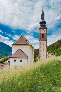 Village church amongst the hills and grass