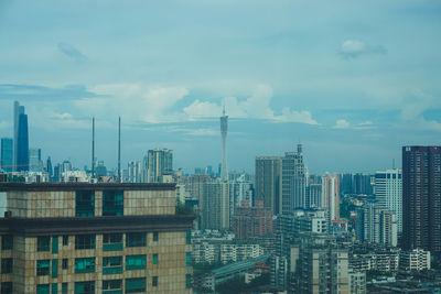 Modern buildings in city against sky