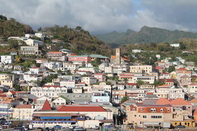 High angle shot of townscape against clouds