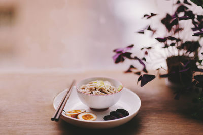 Close-up of noodles served on table