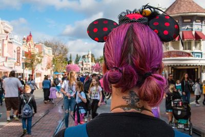 Rear view of woman with dyed hair in city