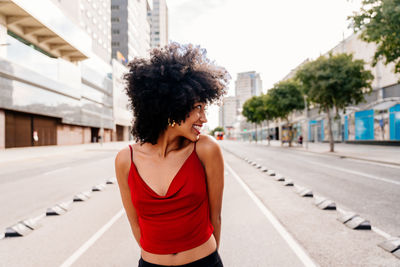 Young woman standing on road