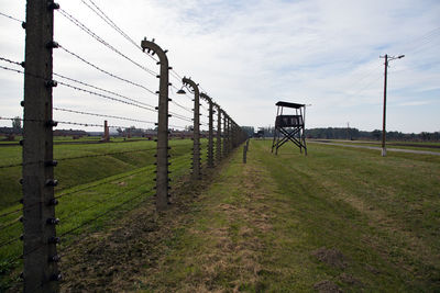 Prisoner fence and tower guard, auschwitz birkenau concentration camp