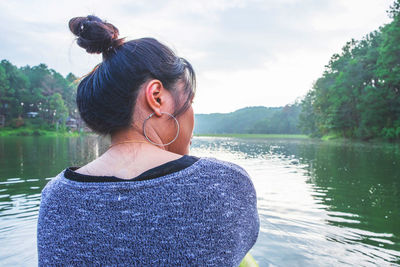 Rear view of woman in lake