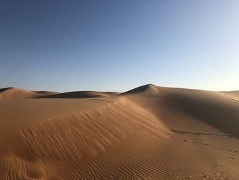 Scenic view of desert against clear sky