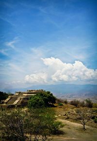 Scenic view of landscape against blue sky