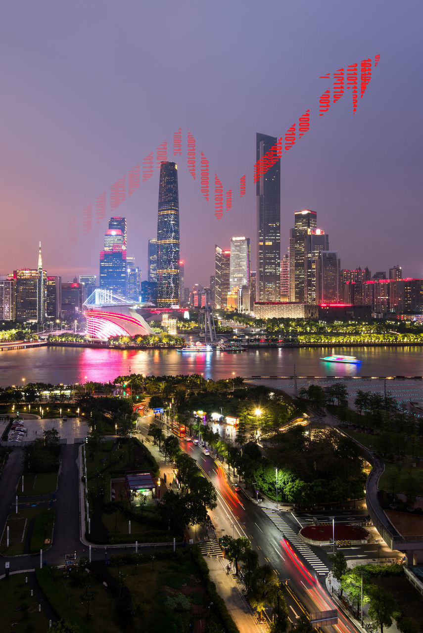 HIGH ANGLE VIEW OF ILLUMINATED BUILDINGS AT NIGHT