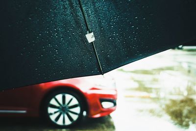 Close-up of car on road