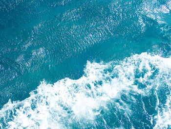 High angle view of waves splashing in sea