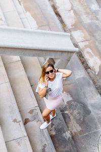 High angle view of woman wearing sunglasses outdoors