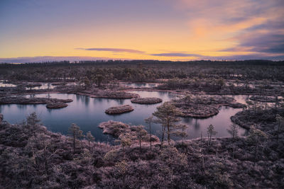 Scenic view of lake against sky during sunset