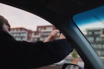 Close-up of man hand holding car