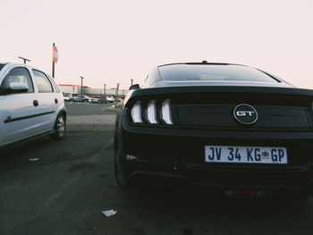 Cars on road against clear sky