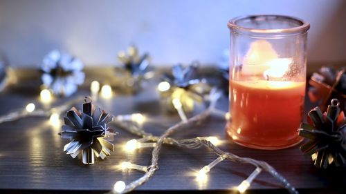 Close-up of tea light candle on table