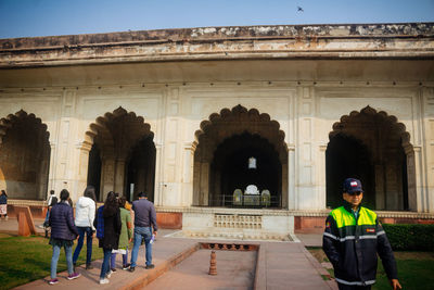 Group of people in front of historical building