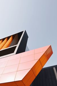 Low angle view of modern building against clear sky