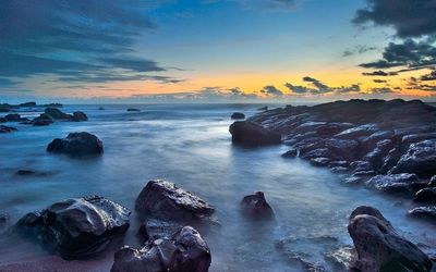 Scenic view of sea at sunset