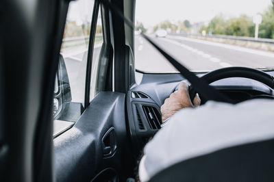 Close-up of man driving car